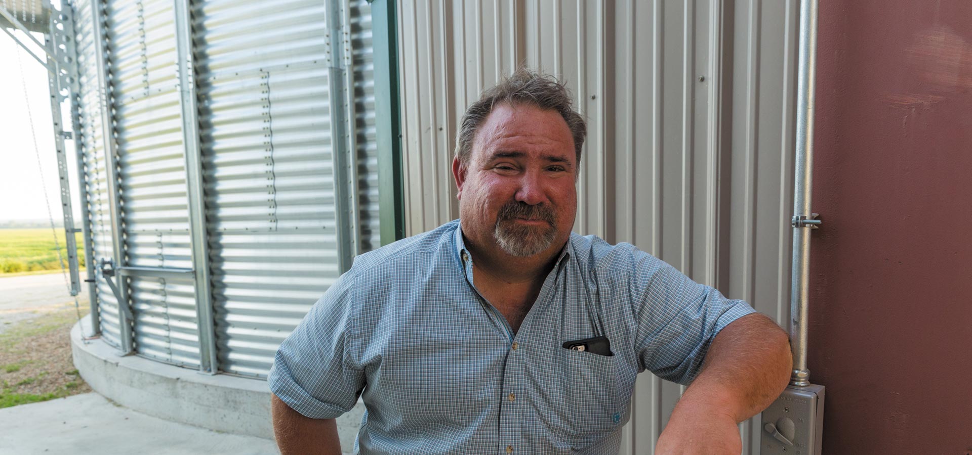 farmer smiling at the camera up close